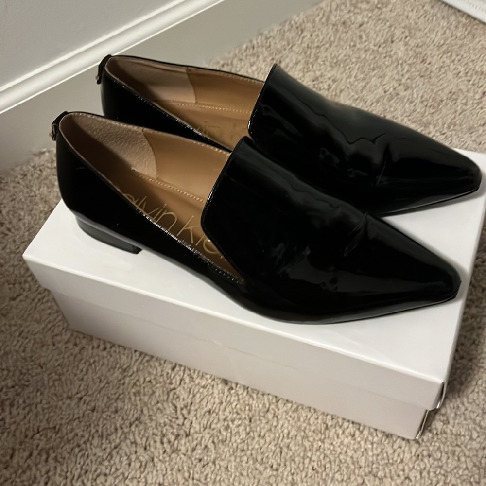 Black patent Calvin Klien flats